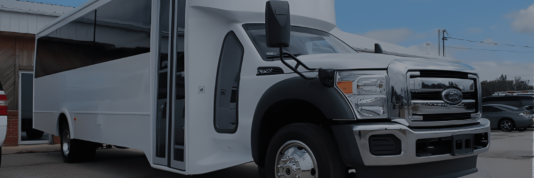 Large white bus with tinted windows