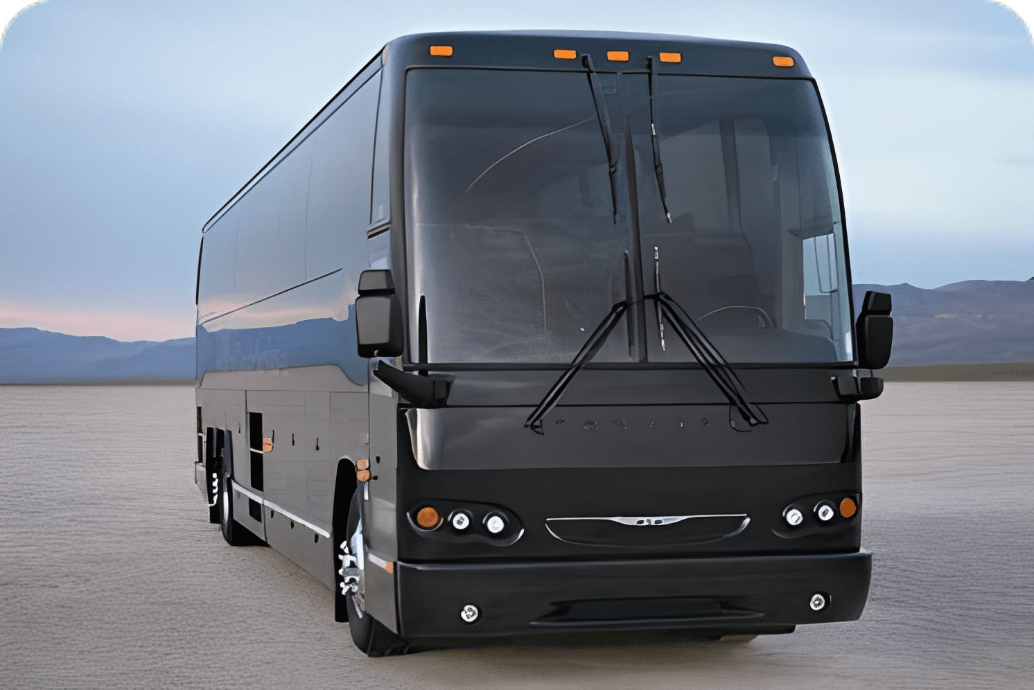 Modern coach bus in a sandy landscape