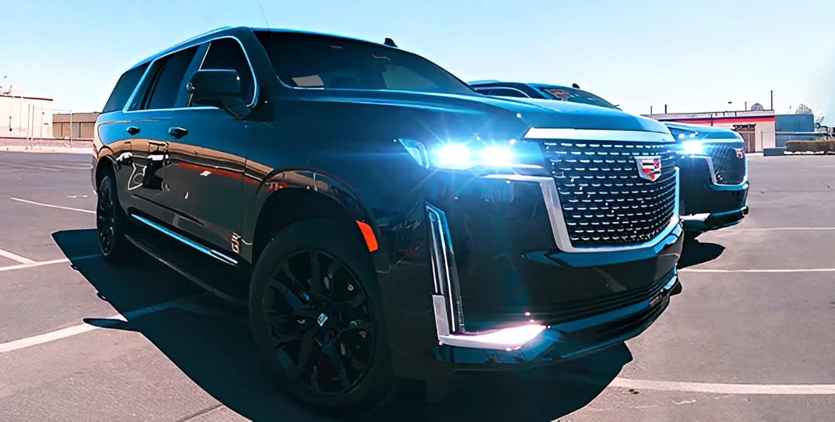 Luxury black SUV with bright headlights