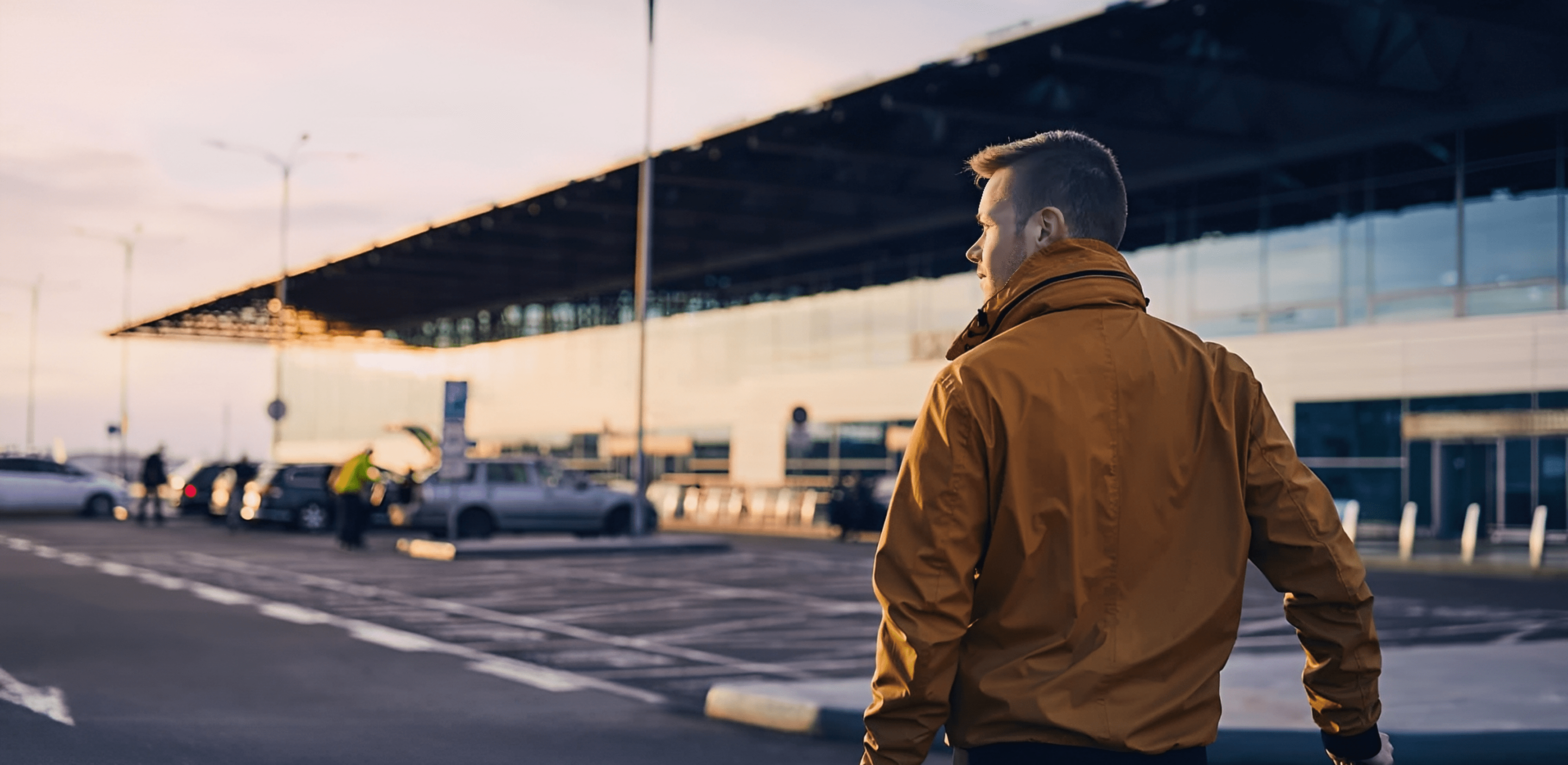 Person outside modern airport building
