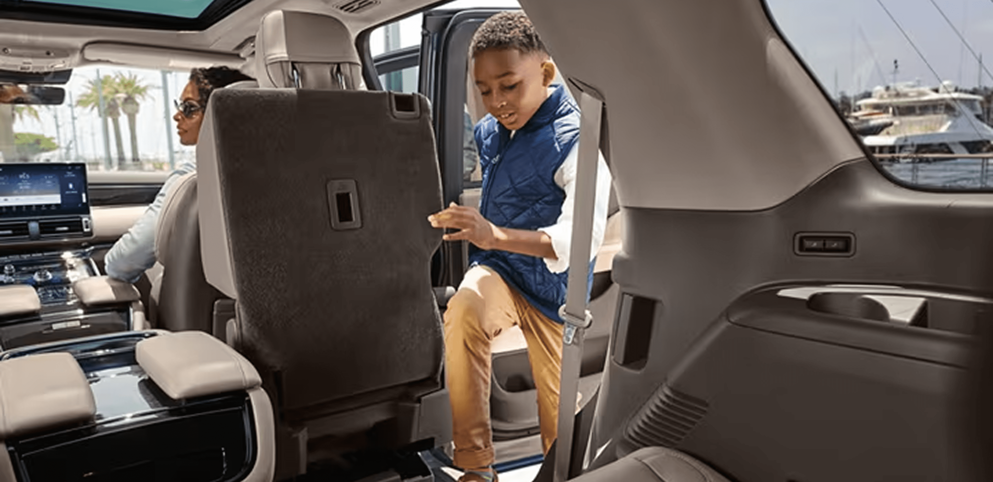 Child entering luxury SUV interior