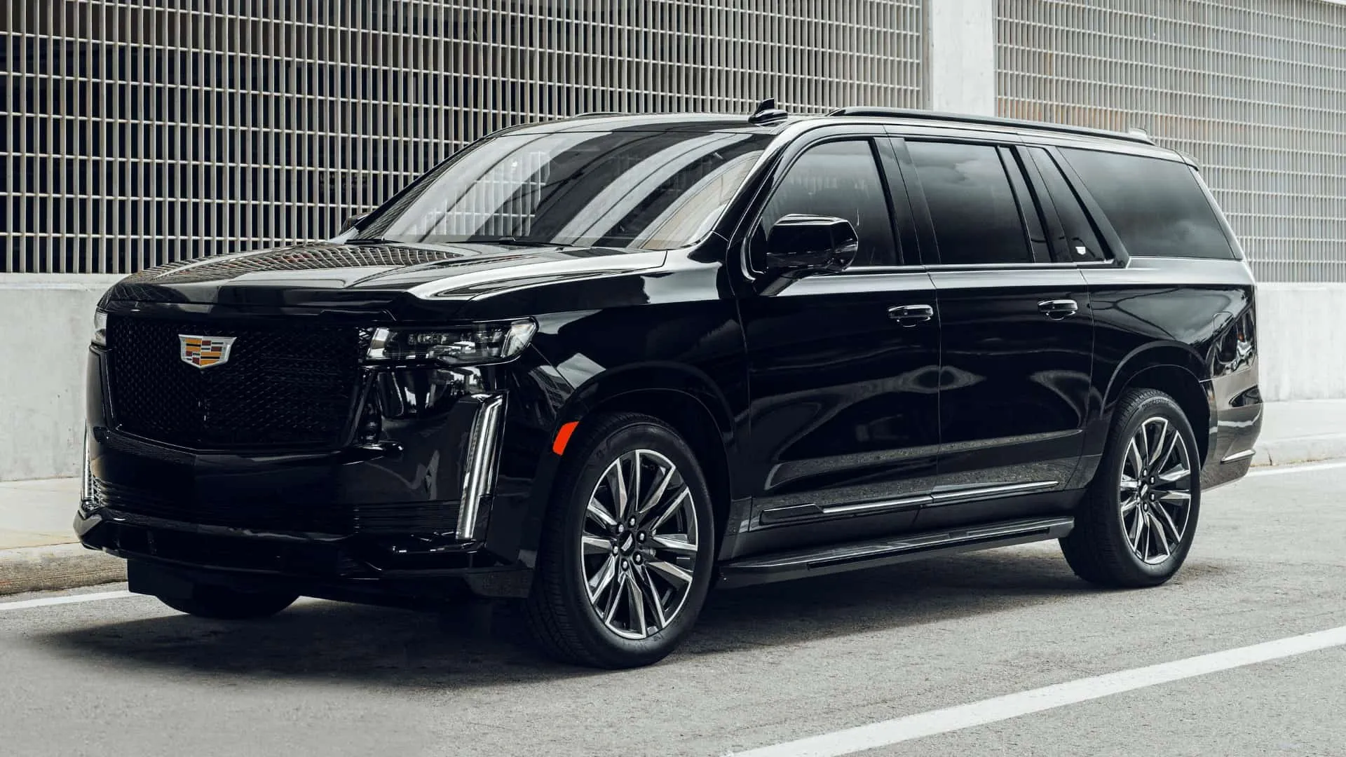 Black luxury SUV parked on street
