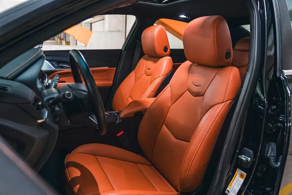 Modern car interior featuring orange upholstery