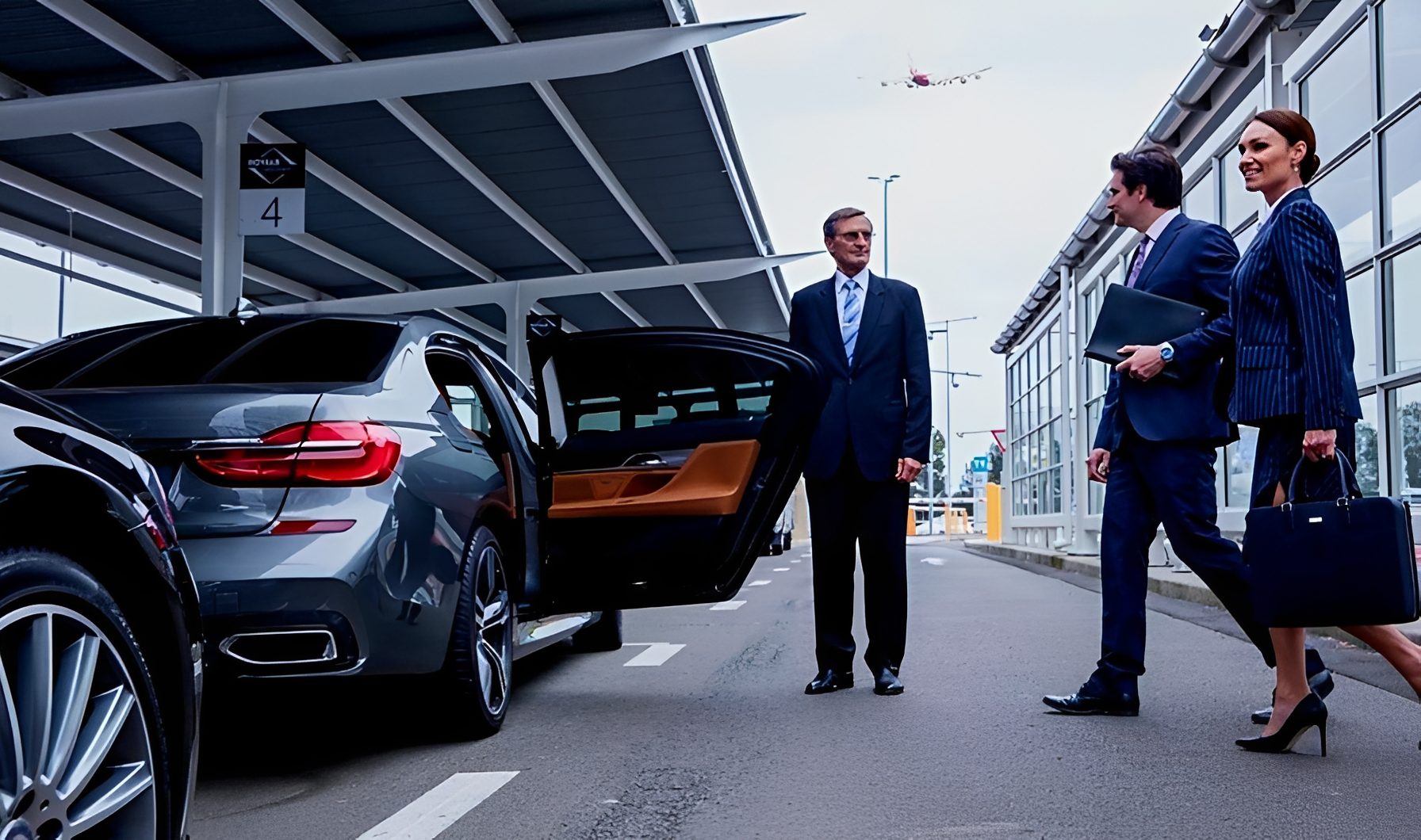 Businesspeople meeting at airport car pickup