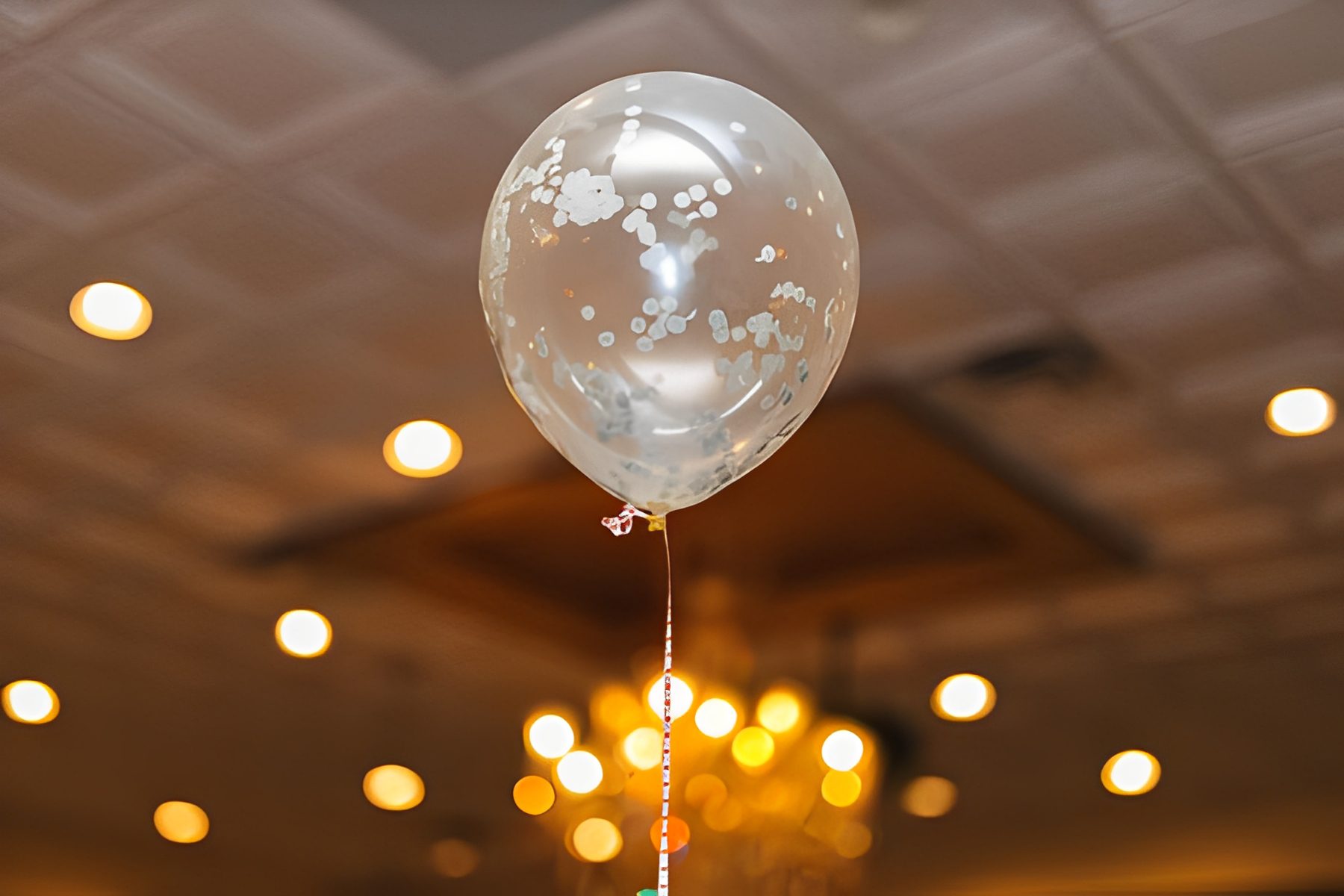 Transparent balloon with confetti pattern